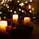 white candles on brown wooden table